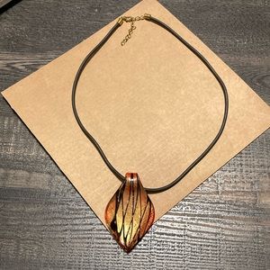 Gold/red/black necklace with glass pendant